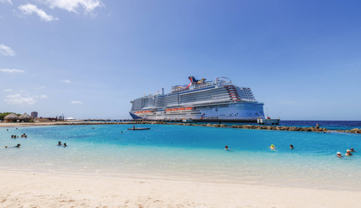 Carnival Celebration Docked Next to Beach in Curacao