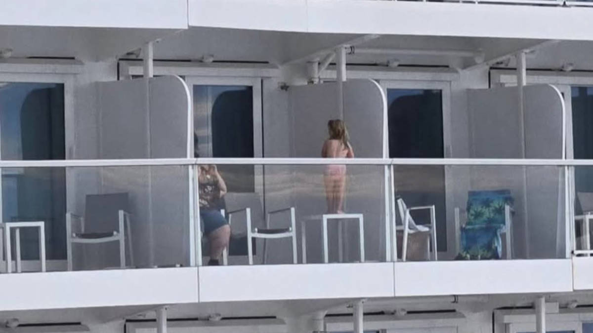 Child Standing on a Table on the Edge of a Cruise Ship Balcony