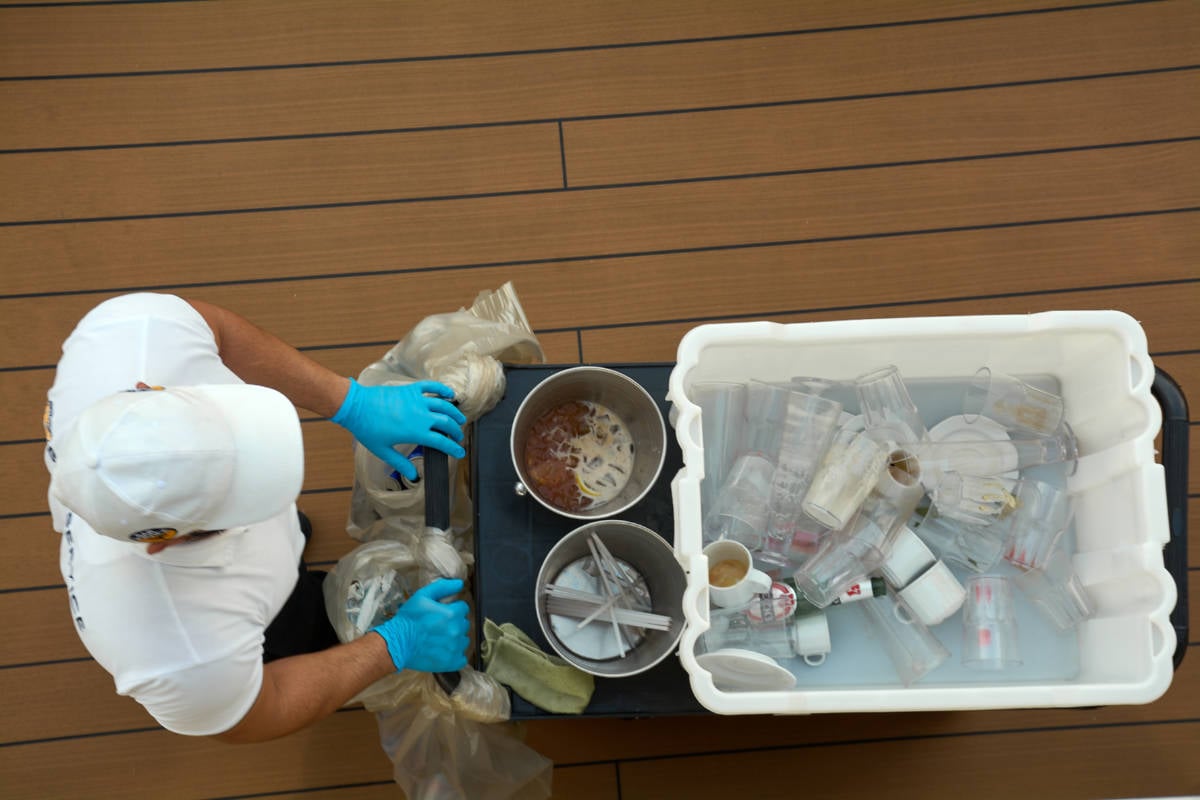 Cruise Crew Member Cleaning Dishes