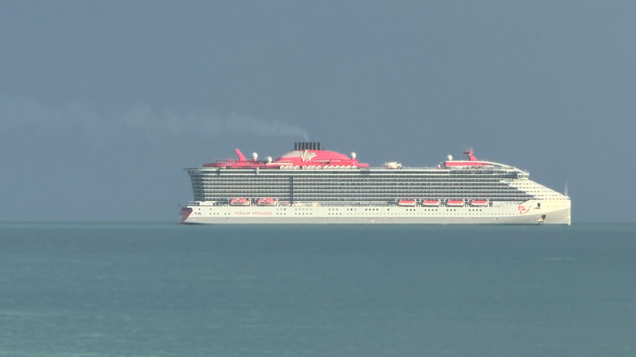 Brilliant Lady Cruise Ship With Dark Clouds